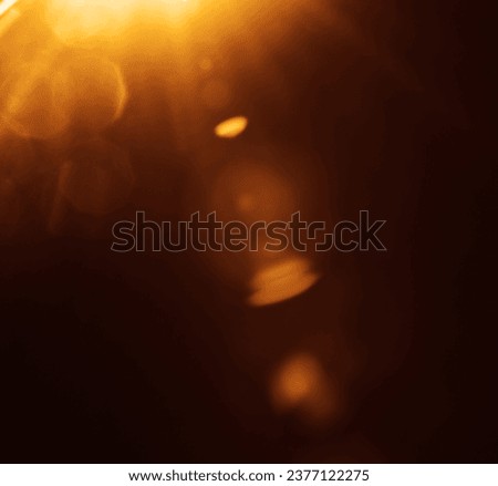 Easy to add lens flare effects for overlay designs or screen blending mode to make images. Abstract sunburst, digital flare, iridescent glaze over black background. Abstract colorful  light effect  Royalty-Free Stock Photo #2377122275