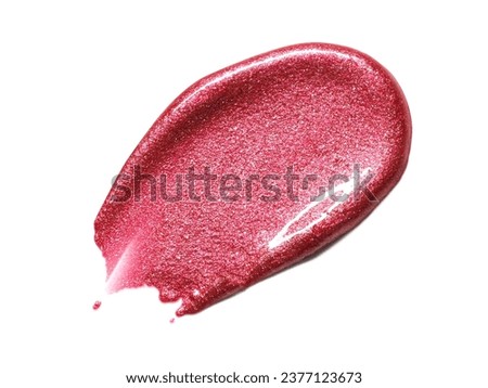Red metallic shimmering lipgloss texture isolated on white background. Smudged cosmetic product smear. Makup swatch product sample Royalty-Free Stock Photo #2377123673