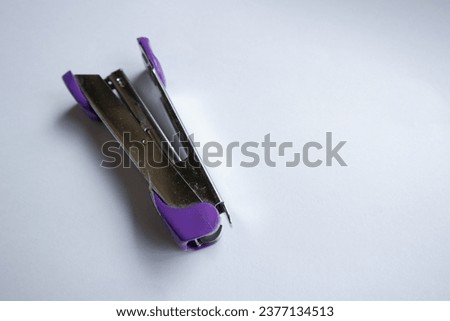 Stapler on a white background selective focus