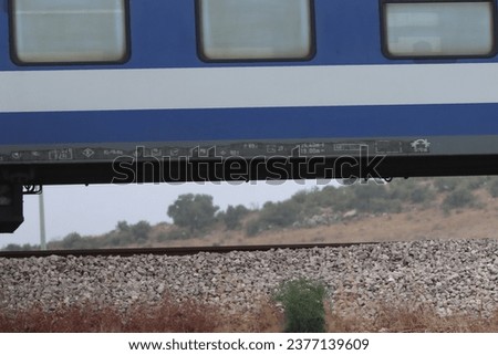 A train is traveling fast on the tracks