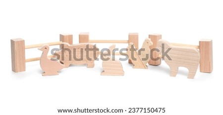 Kit with wooden farm animal figures isolated on white. Educational toy for motor skills development Royalty-Free Stock Photo #2377150475