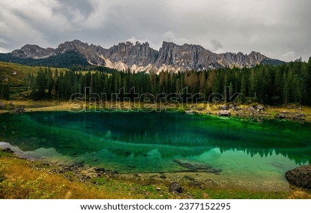 Forest lake in the mountains. Mountain lake landscape. Forest lake in mountains. Mountain lake in forest