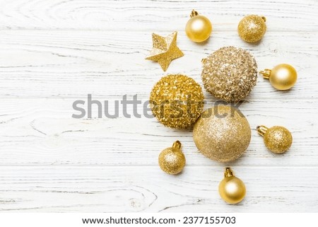 Creative set of New Year baubles and decorations on wooden background. Top view of Christmas time concept. Copy space.