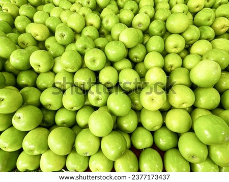 Pile of Green jujube fruit background  Royalty-Free Stock Photo #2377173437