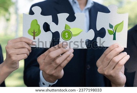 Business people or corporate partnership joining ECO friendly idea puzzle of jigsaw together as group of eco professional teamwork concept to promote social awareness on environmental protection. Gyre