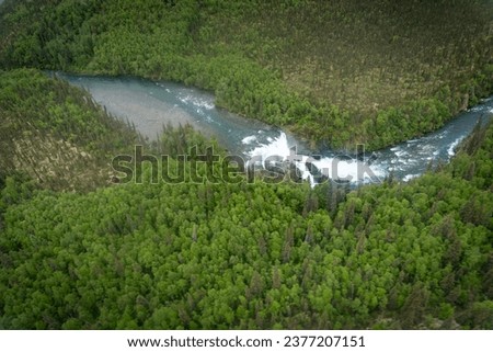Lake Clark National Park in Alaska. Tanalian Falls and river. Aerial view of spruce trees, rugged mountains and popular day hike area near Port Alsworth and Hardenburg Bay. Royalty-Free Stock Photo #2377207151