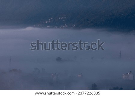 Winter Mesmerizing Foggy landscape view of a countryside.