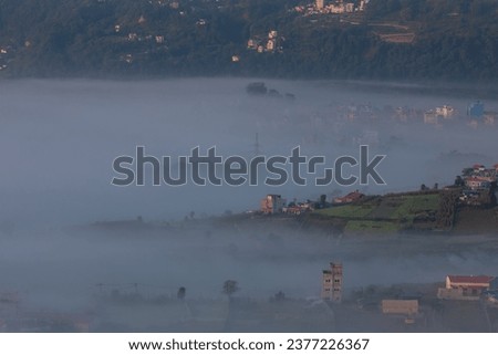 Winter Mesmerizing Foggy landscape view of a countryside.