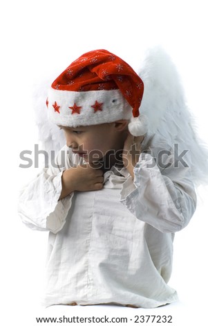 little boy as angel in red xmas hat