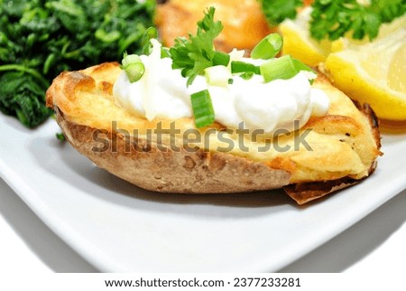Twice Baked Potato with Fresh Sour Cream and Chives	 Royalty-Free Stock Photo #2377233281