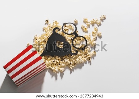 Popcorn bucket and photo booth prop for movie party on white background
