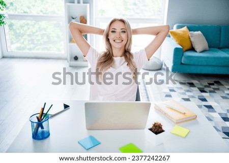 Photo of cute lovely girl successful boss sitting modern room workspace holding hands behind head done task