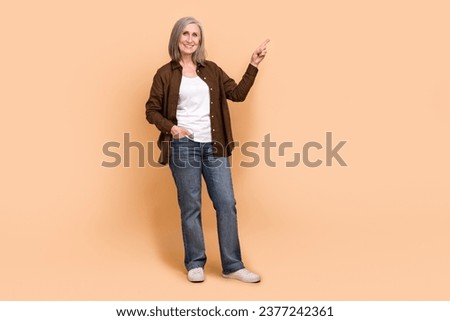 Full body photo of cheerful senior woman indicating finger novelty cheap new market advertisement ad isolated on beige color background