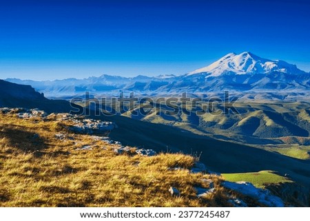 View from the Bermamyt plateau to Mount Elbrus Royalty-Free Stock Photo #2377245487