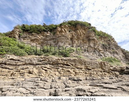 It is wonderful that the coastal cliffs are formed by a stack of long strata, forming natural and wonderful layers to create abstract patterns. Royalty-Free Stock Photo #2377265241