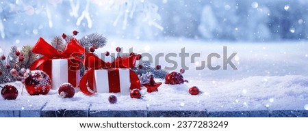 Christmas Gifts With Red Bows On A Winter Forest Background