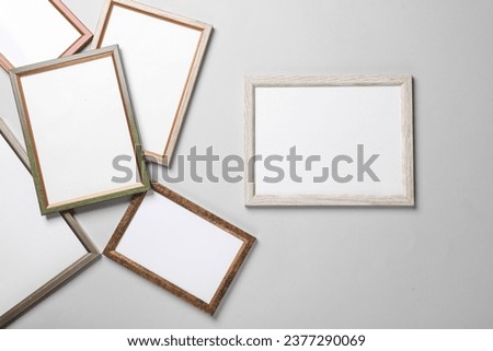 Blank wall frames on a gray background