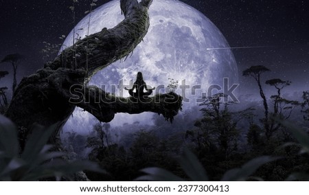 Woman meditating in front of the moon