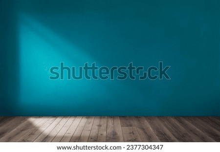 Blue wall in an empty room with wooden floor Royalty-Free Stock Photo #2377304347