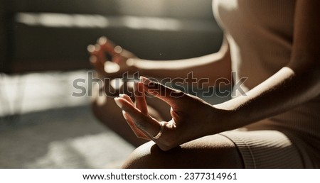 Meditation, hands woman in lotus pose on a floor for peace, zen or mental health wellness at home. Breathing, relax and female person in living room for energy training, exercise or holistic practice Royalty-Free Stock Photo #2377314961