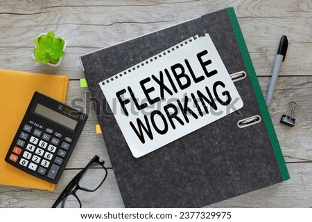 Flexible working text in notepad in a folder. near a yellow notepad with a calculator