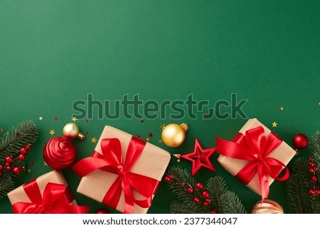 Let the gift-hunting begin: create holiday memories now. Top view composition of festive gift boxes, tree ornaments, fir twigs, shiny stars on green background with promo space