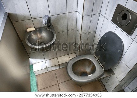 Toilet in a prison cell in a prison. Royalty-Free Stock Photo #2377354935