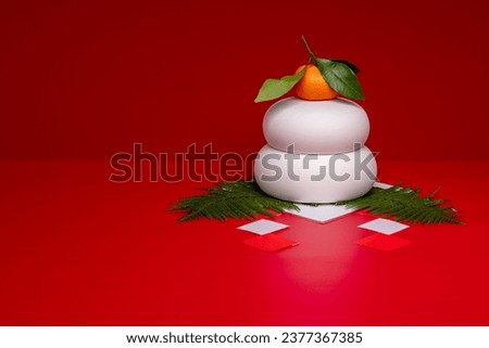 Kagamimochi is an offering to God.
Kagamimochi is on the right side of the red background.
There is no base. Ceramic Kagamimochi. Royalty-Free Stock Photo #2377367385