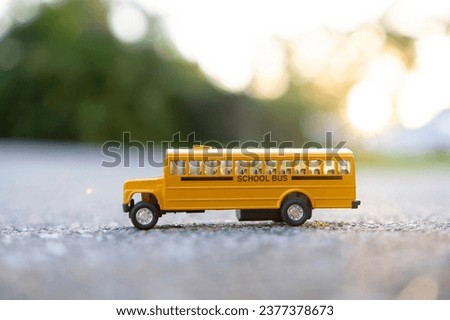 Toy american yellow school bus as symbol of education in the USA
