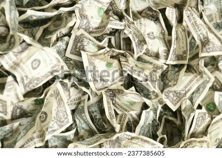 A stack of twenty-dollar bills forms a substantial and enticing pile