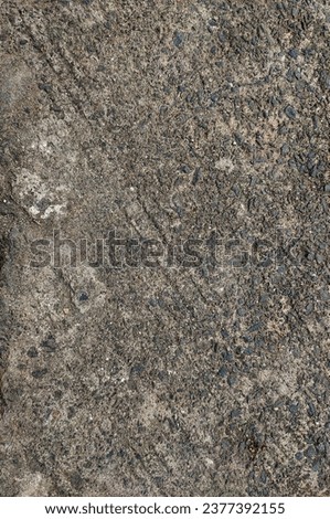 photo of cement texture with pebbles 