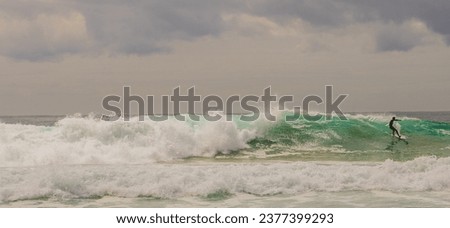 Surfers at Manly Beach Sydney Australia, big waves