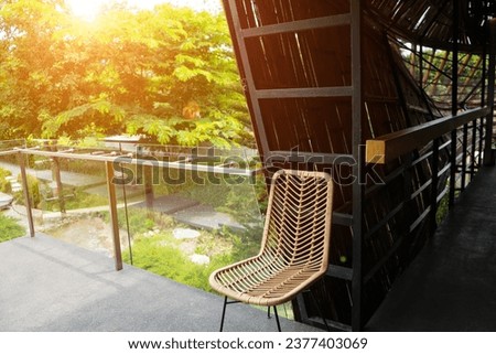 Wicker seamless pattern chairs is basketwork on the terrace for see view with tree and sunlight background.