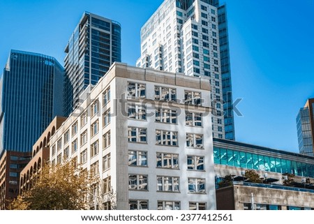 Skyscape of a group of modern office buildings in Vancouver BC. New area with new multi-storey buildings. Cityscape office buildings with modern corporate architecture - business and success concept