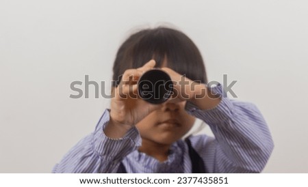 little girl with binoculars on white background