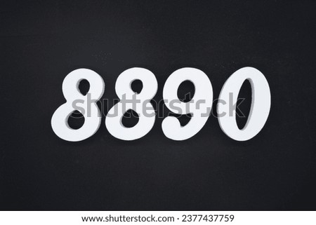Black for the background. The number 8890 is made of white painted wood.