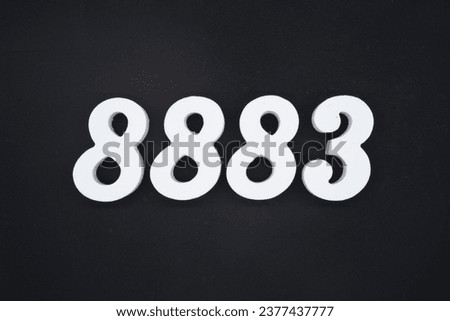 Black for the background. The number 8883 is made of white painted wood.