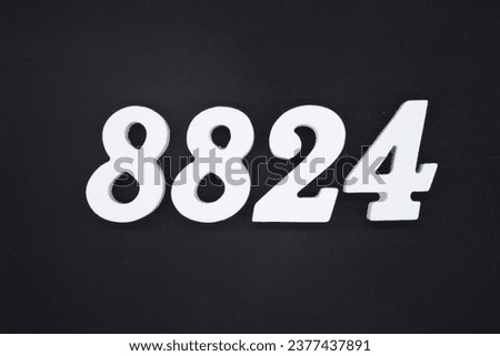 Black for the background. The number 8824 is made of white painted wood.