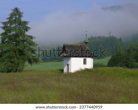 Chapel in Titisee-Neustadt, early morning mist, flower meadow, Black Forest. Bad. -Wuerttemb. FRG Royalty-Free Stock Photo #2377440959