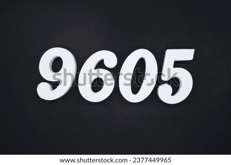 Black for the background. The number 9605 is made of white painted wood.