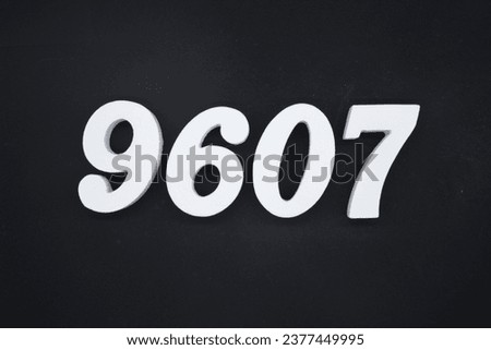 Black for the background. The number 9607 is made of white painted wood.