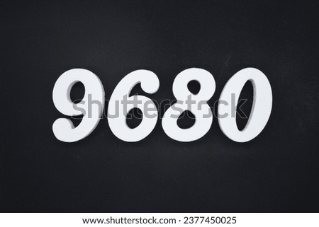 Black for the background. The number 9680 is made of white painted wood.