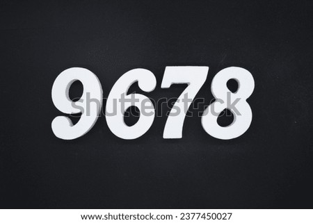 Black for the background. The number 9678 is made of white painted wood.