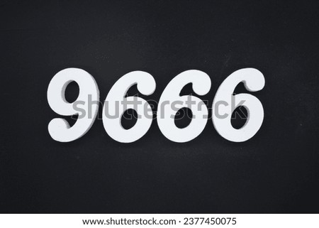 Black for the background. The number 9666 is made of white painted wood.