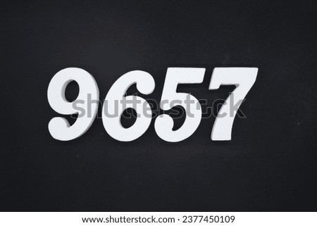 Black for the background. The number 9657 is made of white painted wood.