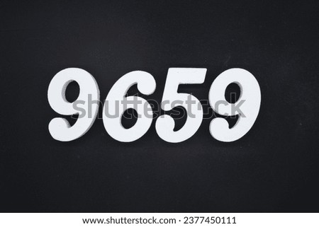 Black for the background. The number 9659 is made of white painted wood.