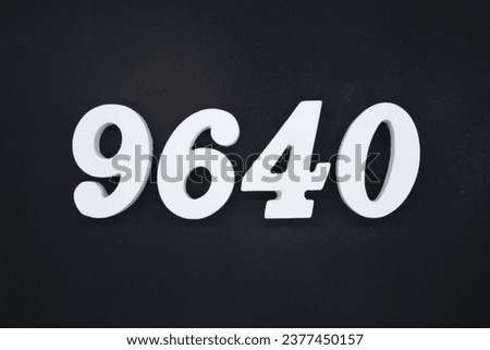 Black for the background. The number 9640 is made of white painted wood.
