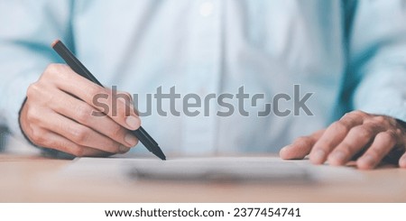 Businessman checking contract documents ,handle business documents and agreements ,Business contract signing ,business cooperation ,Signing to approve contract or warranty documents 
