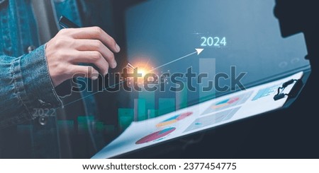 Merry Christmas and Happy New Year 2024 concept, Planning start new business and life ,business appraisal ,businessman new year business goals ,marketing strategy planning ,Trends in financial success Royalty-Free Stock Photo #2377454775