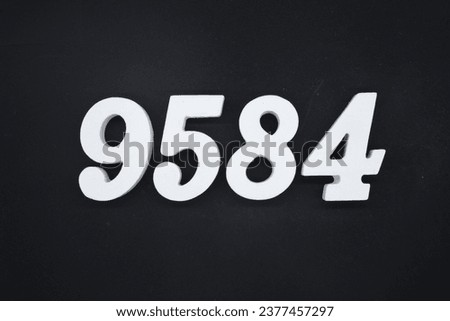 Black for the background. The number 9584 is made of white painted wood.